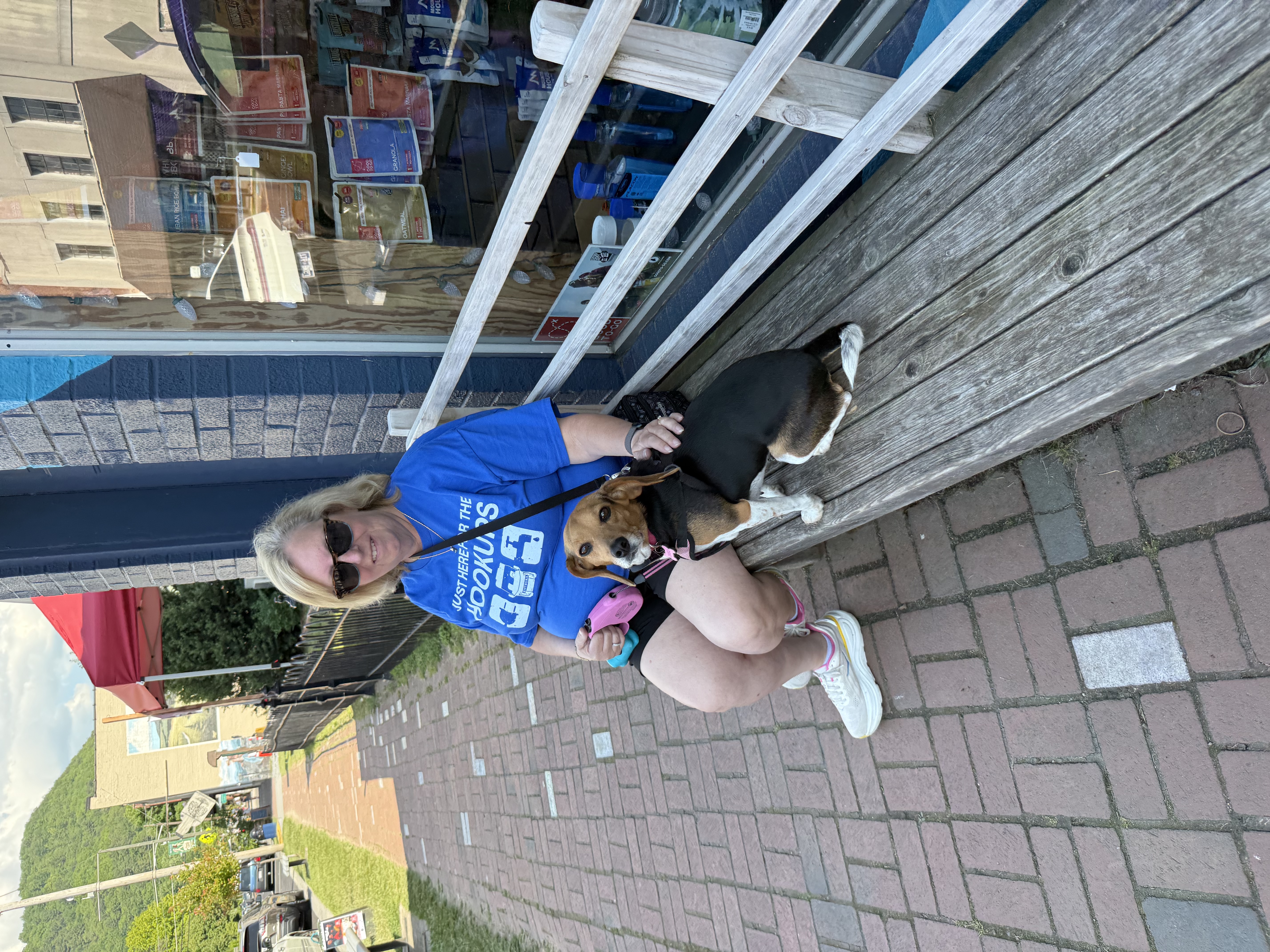 Donna and Juneaux sitting on a bench in downtown Damascus