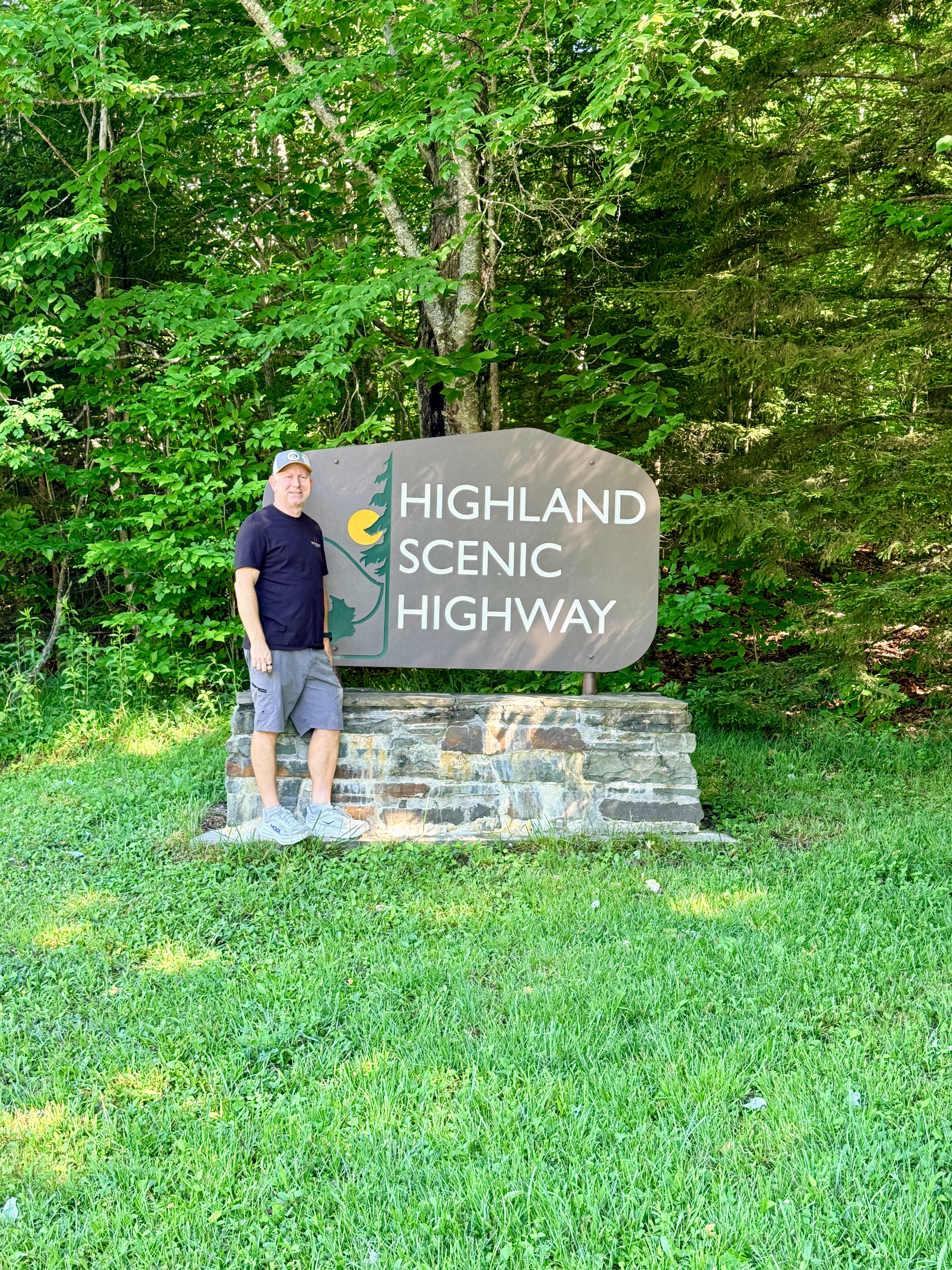 Chad standing by Highlands Scenic Highway Sign