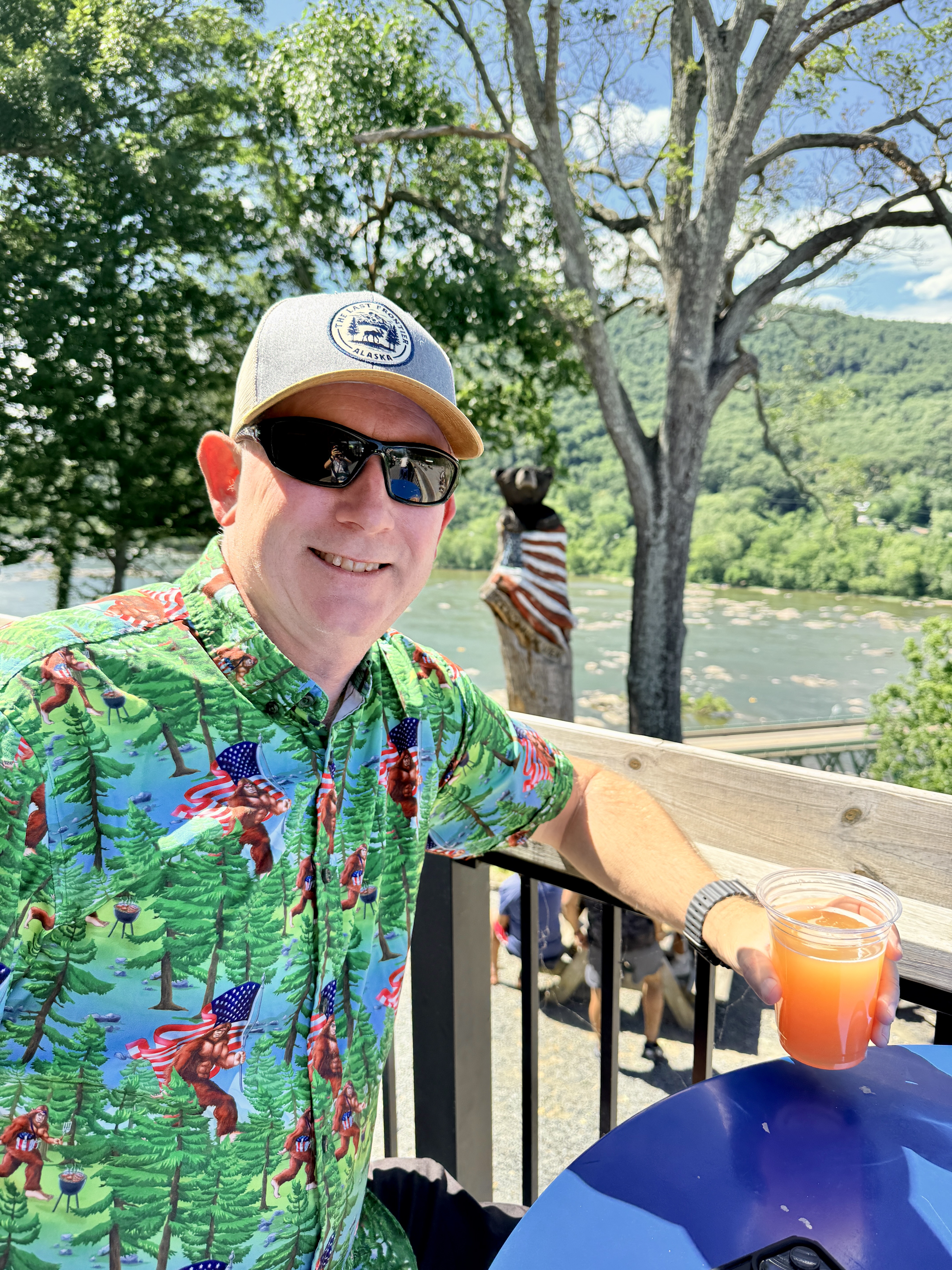 Chad enjoying a beer while overlooking river at Harpers Ferry Brewing